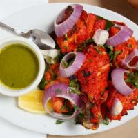 Tandoori Chicken · One half of a whole chicken on the bone marinated with ginger, garlic and cooked in the tand...