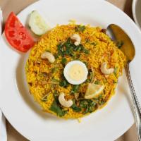Biryani · Streamed saffron basmati rice seasoned with traditional Indian spices.