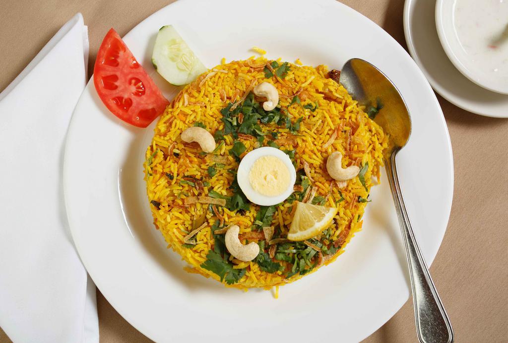 Biryani · Streamed saffron basmati rice seasoned with traditional Indian spices.