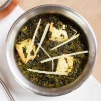 Saag Paneer · Homemade cheese dices cooked with delicately spiced, and creamy chopped spinach.