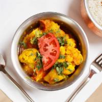 Aloo Gobi · Seasoned potatoes, tomatoes and cauliflower with a touch of an onion based sauce.
