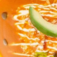 Sopa De Tortilla · Tomato & guajillo soup, crispy tortilla, Chihuahua cheese, cream, avocado