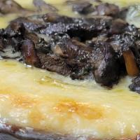 Queso Fundido · Mexican cheese fondue, tomatillo salsa, huitlacoche mushrooms and flour tortillas.