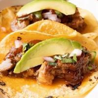 Tacos De Carne Asada · Carne asada, chipotle salsa, avocado, onions and cilantro. 2 tacos per order. Appetizer size.