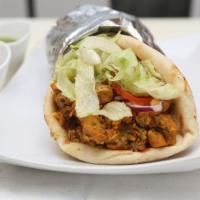 Chicken Gyro · Organic chicken gyro meat, served on warm pita bread with lettuce, onions, tomatoes, and whi...