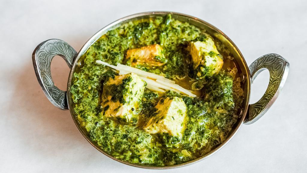 Saag Paneer  · Spinach and cheese cooked with mild or hot spices.
