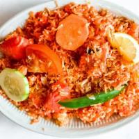 Chicken Tikka Biryani · Long grain rice flavored with saffron, cooked in mughlai style with chicken, tikka, eggs, nu...