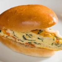 Vegetable Egg Frittata · Spinach and tomato, on whole-wheat bread. Soft house-baked rolls with a delicate crust perfu...