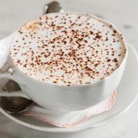 Sant Ambroeus Coffee · Espresso in a large cup, with thick hot chocolate, milk foam, cocoa powder.