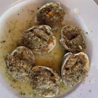 Clams Oregenata · Little neck Clams baked on a half shell, lemon butter sauce