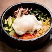 Bibimbap - Spicy Pork. · sizzling hot stone bowl w/ rice on the bottom, vegetables, egg and choice of meat on top