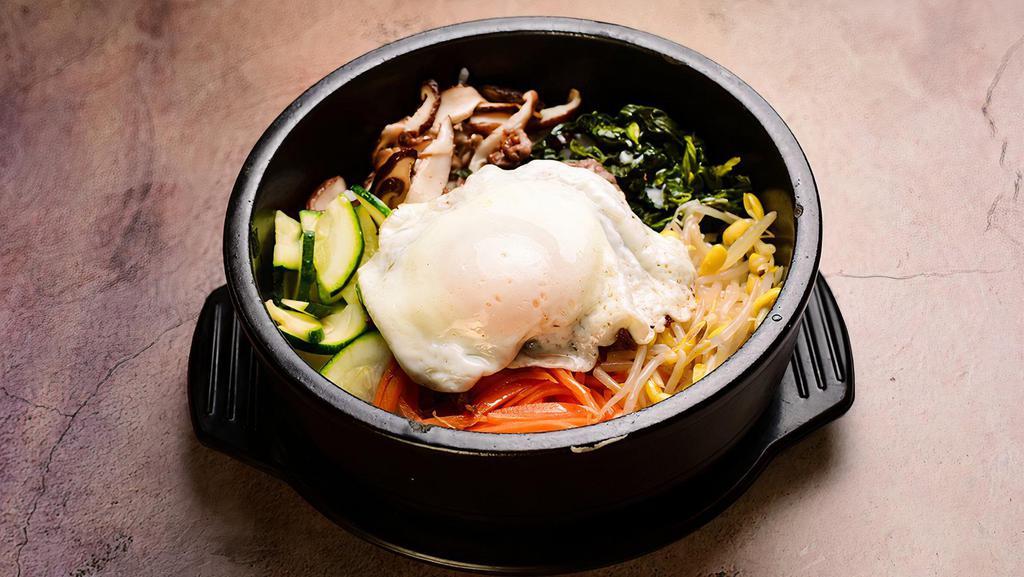 Bibimbap - Spicy Chicken. · sizzling hot stone bowl w/ rice on the bottom, vegetables, egg and choice of meat on top