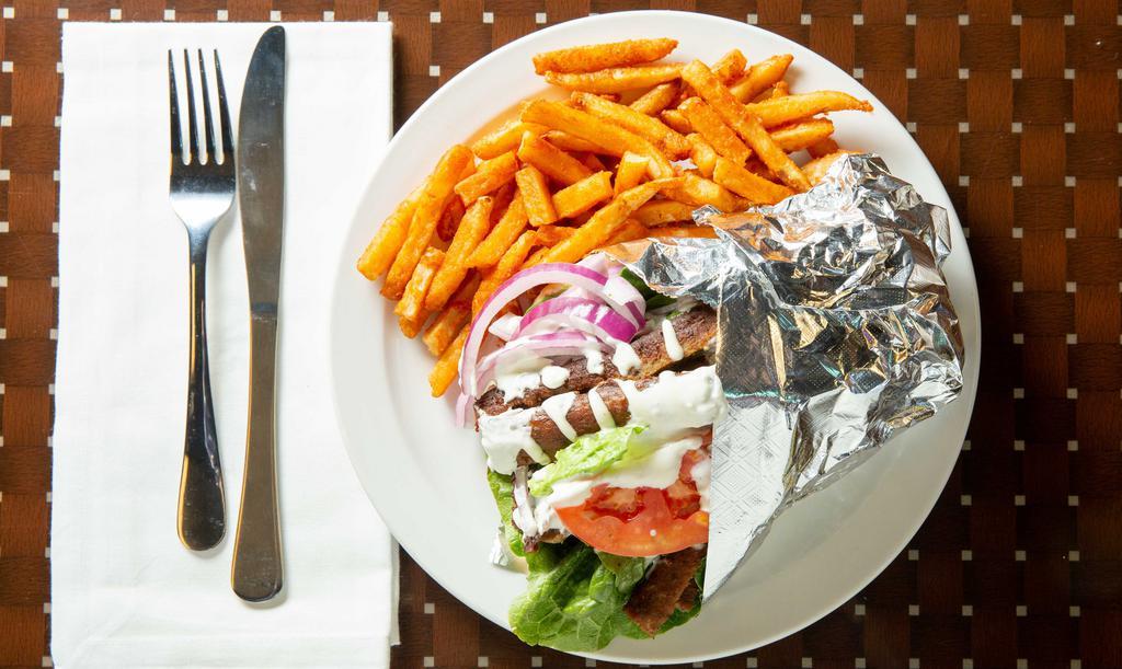 Beef Gyro Sandwich · Served with tzatziki sauce, lettuce, onions and tomatoes. Includes French fries.