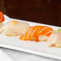 Crispy Sushi · Spicy tuna, salmon, yellowtail and white tuna over crispy rice with chef special sauce.