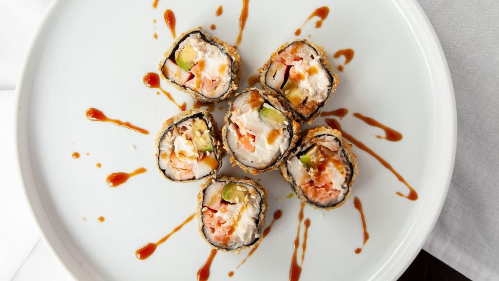 Hard Rock Roll · Spicy kani, avocado, cucumber, topped with rock shrimp and caviar. - spicy.