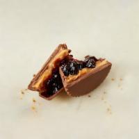 Peanut Butter & Jelly Cup · Milk chocolate with peanut butter and grape jelly.