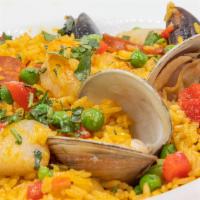 Paella De Mariscos · No sides come with dish. Traditional paella served in a casserole with a Cuban twist includi...
