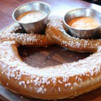 Bavarian Pretzel · Jumbo pretzel served with house-made beer cheese and creamy mustard dipping sauce.