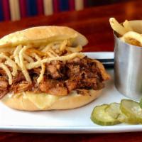Guinness Bbq Pulled Pork Sandwich · Guinness BBQ pulled pork, frizzled onions, pepper jack, coleslaw, Portuguese roll, hand cut ...