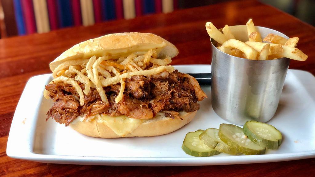 Guinness Bbq Pulled Pork Sandwich · Guinness BBQ pulled pork, frizzled onions, pepper jack, coleslaw, Portuguese roll, hand cut french fries