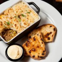 Shepherd'S Pie · Ground beef, peas, carrots, corn topped with mashed potatoes. Served with Irish soda bread