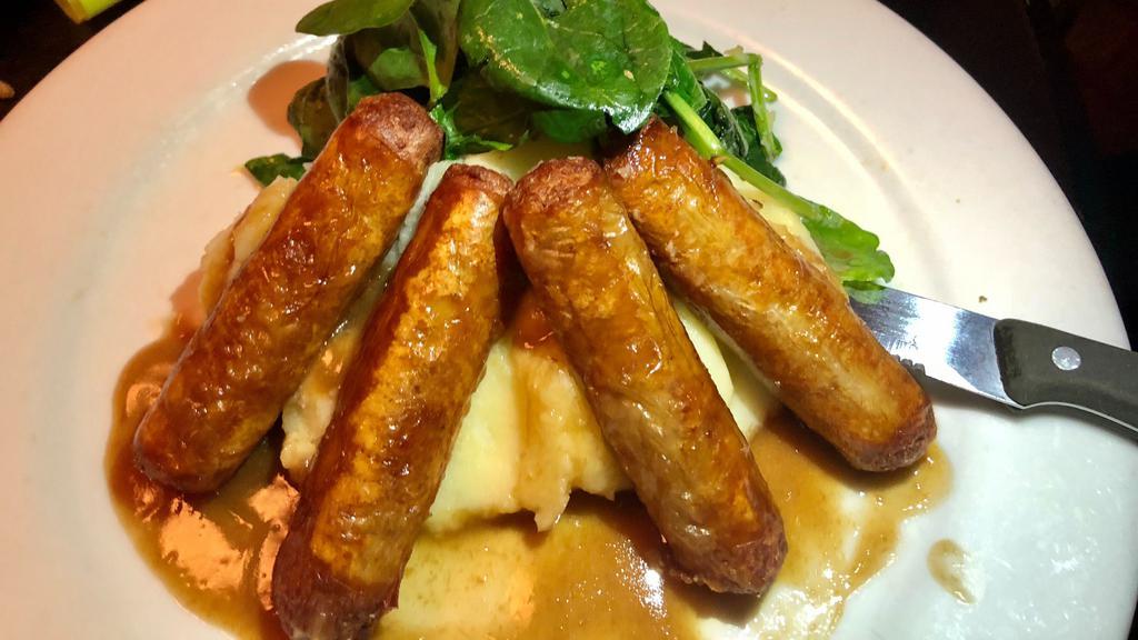 Bangers & Mash · Irish sausage, mashed potatoes, sautéed garlic spinach, horseradish gravy