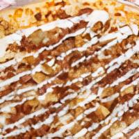 Chicken Bacon Ranch Pizza · Traditional Neapolitan style pizza topped with chicken, bacon, and mozzarella cheese, drizzl...