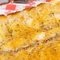 Garlic Bread · Italian bread basted with fresh garlic, olive oil, and Italian spices baked to perfection.