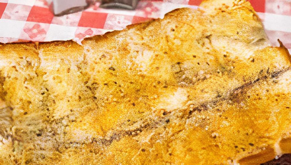 Garlic Bread · Italian bread basted with fresh garlic, olive oil, and Italian spices baked to perfection.