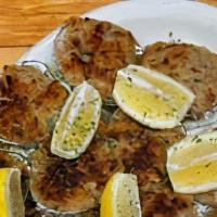 Baked Clams · Six pieces.