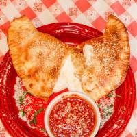 Calzone · Pizza dough pocket filled with seasoned ricotta and mozzarella cheese. Add pepperoni, meatba...