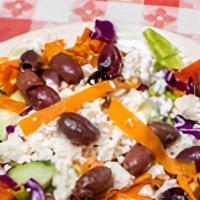 Greek Salad · Romaine lettuce mixed with tomato, shredded carrots, cabbage, red onions, red peppers, Kalam...