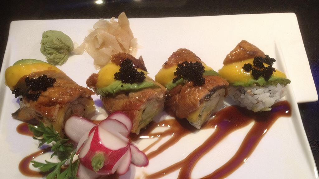 Black Dragon Roll · Crab meat, avocado, cucumber topped with eel, avocado, and black tobiko.