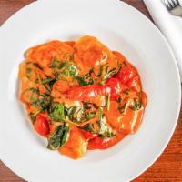 Lobster Raviolis · With porcini mushroom in a grey goose tomato vodka sauce, sprinkled with rayano parmesano, t...