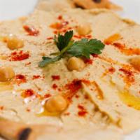 Hummus · Mashed chickpeas blended with tahini, olive oil, lemon juice, garlic.