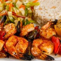 Grilled Shrimp · Served on a skewer grilled peppers and lemon. Served with house salad and rice.