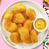 Chicken Nuggets · (12 pieces) Bite sized nuggets of chicken breaded and fried until golden brown.