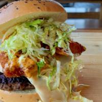 Bangin' Shrimp Burger · Our burger topped with crispy fried shrimp in our Bangin’ sauce, famous cheese sauce, and ic...