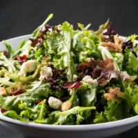 Field Greens Salad · Fresh harvest greens, arugula, baby kale, sun-dried cranberries, walnuts, crumbled blue chee...
