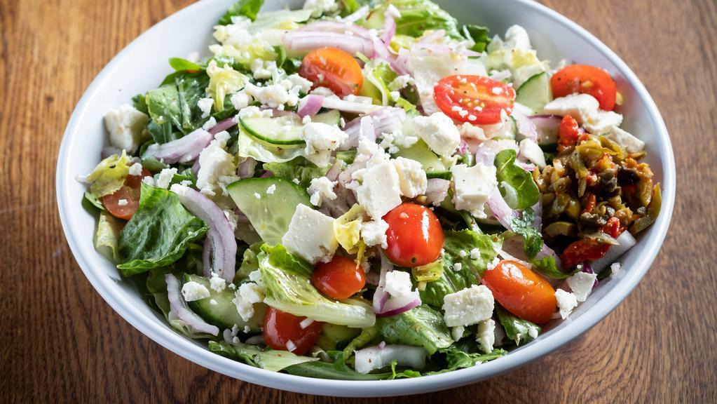 Mediterranean Salad · Arugula, romaine, iceberg, parsley, sliced cucumber, red onion, grape tomatoes, olive, relish, crumbled feta, Chianti vinaigrette.