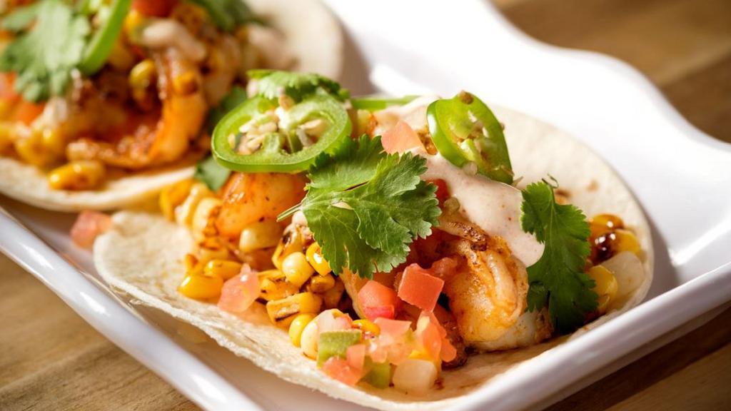 Shrimp Tacos · Shrimp, pico de gallo, roasted corn,
cilantro, jalapeños, chipotle
lime crema