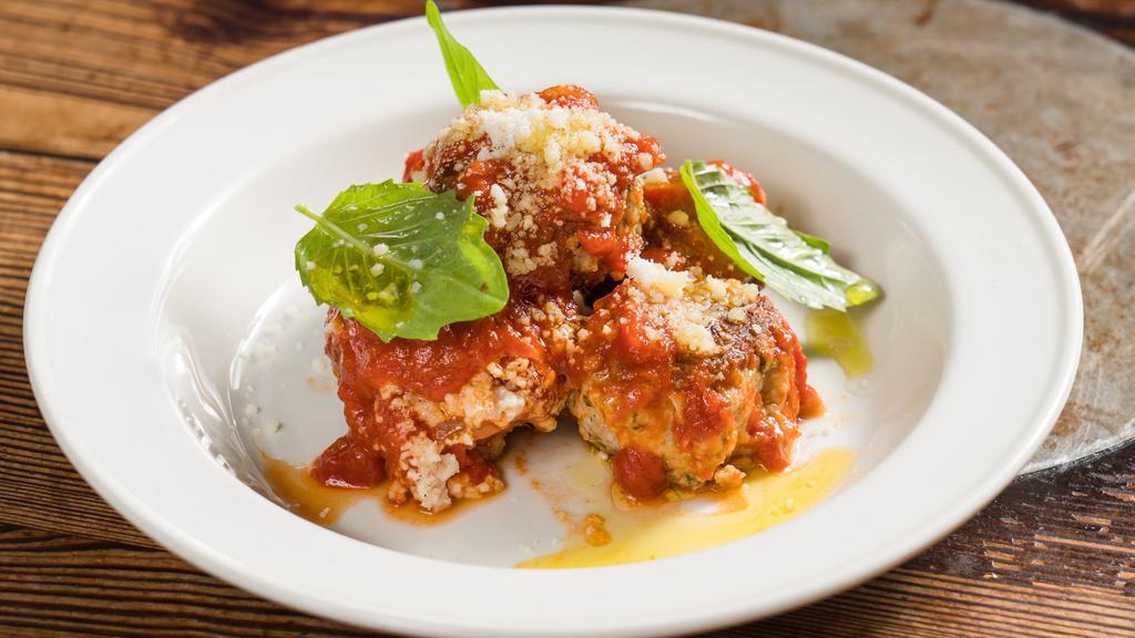 Polpettine · Home-made veal meatballs, tomato sauce and parmigiano-reggiano.