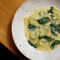 Ravioli Della Casa · housemade spinach and ricotta ravioli, butter and sage sauce, grated Parmigiano-Reggiano