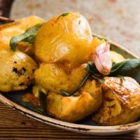 Patate Arrosto · Oven roasted potatoes and herbs.