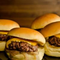 Sliders · Original bachi sliders. Caramelized onions and melted cheese.