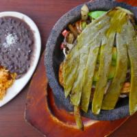 Molcajete Especial · Chicken, beef, shrimp bell peppers, onions, Oaxaca cheese, charred cactus, avocado slice, si...