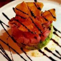Tartare Di Tonno · Sushi grade tuna over smashed avocado, balsamic glaze, chips