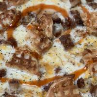 Chicken & Waffle Pizza · Maple Syrup Garlic Base with Fried Chicken and Belgium Waffles with a Hot honey and maple sy...