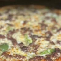 Steak Philly Pizza · garlic sauce, shaved Philly steak, onion, green pepper, mushroom and mozzarella. Topped with...
