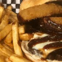 Rodeo Cheeseburger · 1/2 lb flame broiled angus beef steak burger, gourmet onion rings, American cheese, bbq sauc...